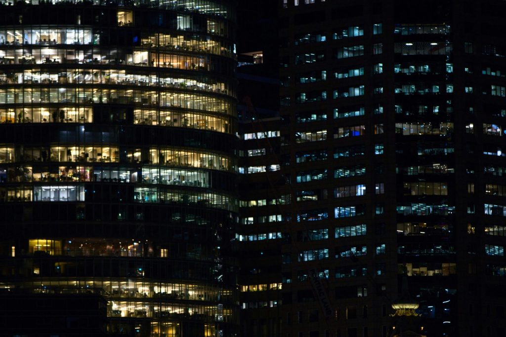 Modern office buildings illuminated at night